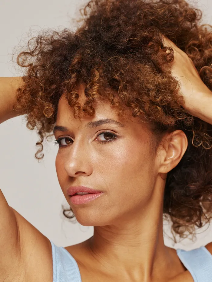 A woman's skin in soft, warm daylight