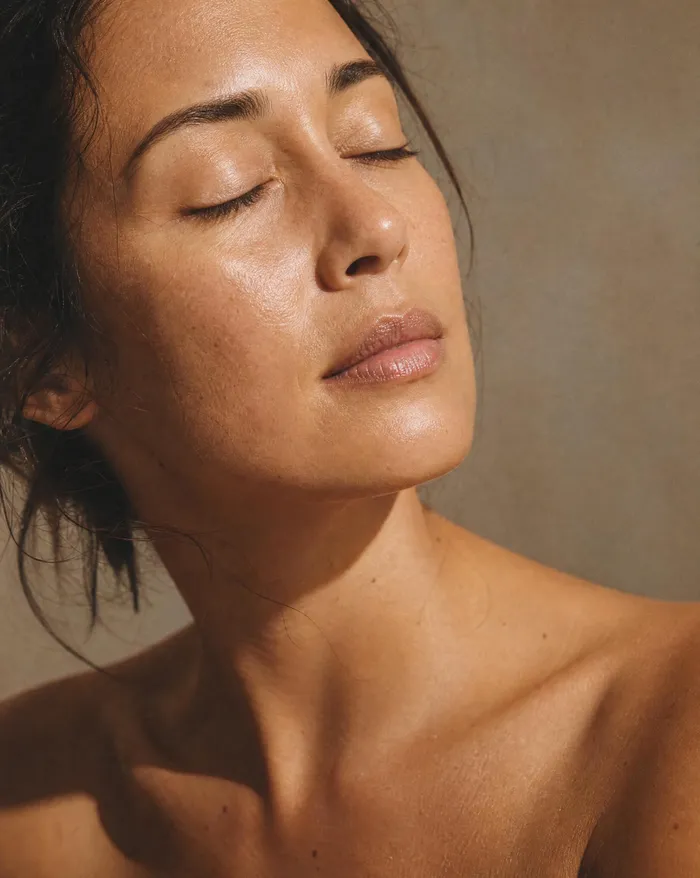 A woman's face in soft, warm daylight